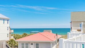 A coastal residential area with houses and a view of the ocean. - Hoos at the Beach - Lovely 4 BR Sea Star Village Townhouse; Ocean View! (Surf City)