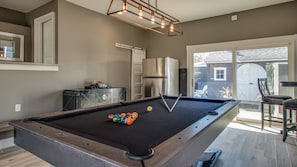 Pool/Ping Pong Table, Darts, extra fridge and plenty of seating space