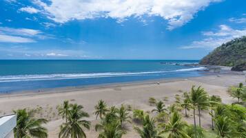 On the beach, sun loungers, beach towels