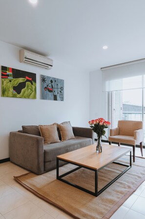 Apartment, 1 Bedroom, Balcony | Living area | 40-inch Smart TV with cable channels, TV