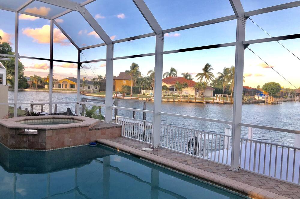 Gorgeous views from this very spacious waterfront Marco Island heated pool home