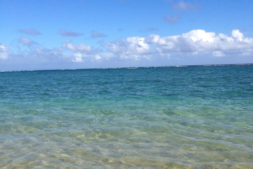 On the beach, sun loungers, beach towels