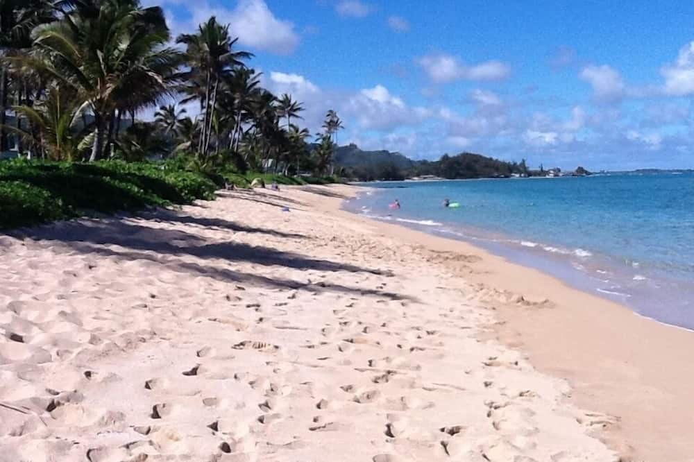 On the beach, sun loungers, beach towels