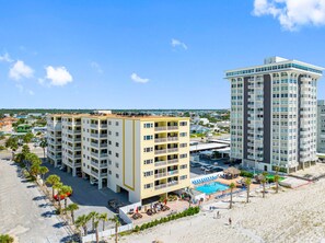 A multi-story hotel with a pool area and beach access. - Best Sunsets on the Beach! 3/3 between Clearwater & St. Pete, Anglers Cove # 107 (Redington Shores)