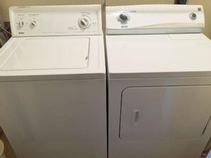 Two stacked white appliances, likely a washer and dryer, in a room. - Doveplum 810- Very cozy 3BD/2.5BA two story, townhouse overlooking the tranquil canal (Siesta Key)