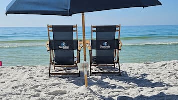 On the beach, sun loungers, beach bar