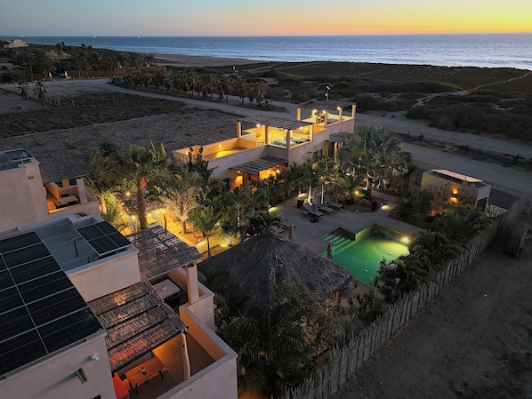 A resort with multiple buildings, a swimming pool, and a view of the ocean. - Vista Tortuga Ocean View VILLA-SUNSET Heated Pool by the BEACH (Todos Santos)