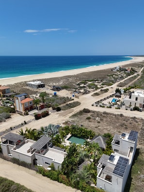 A coastal residential area with houses, a beach, and a clear sky. - Vista Tortuga Ocean View VILLA-SUNSET Heated Pool by the BEACH (Todos Santos)