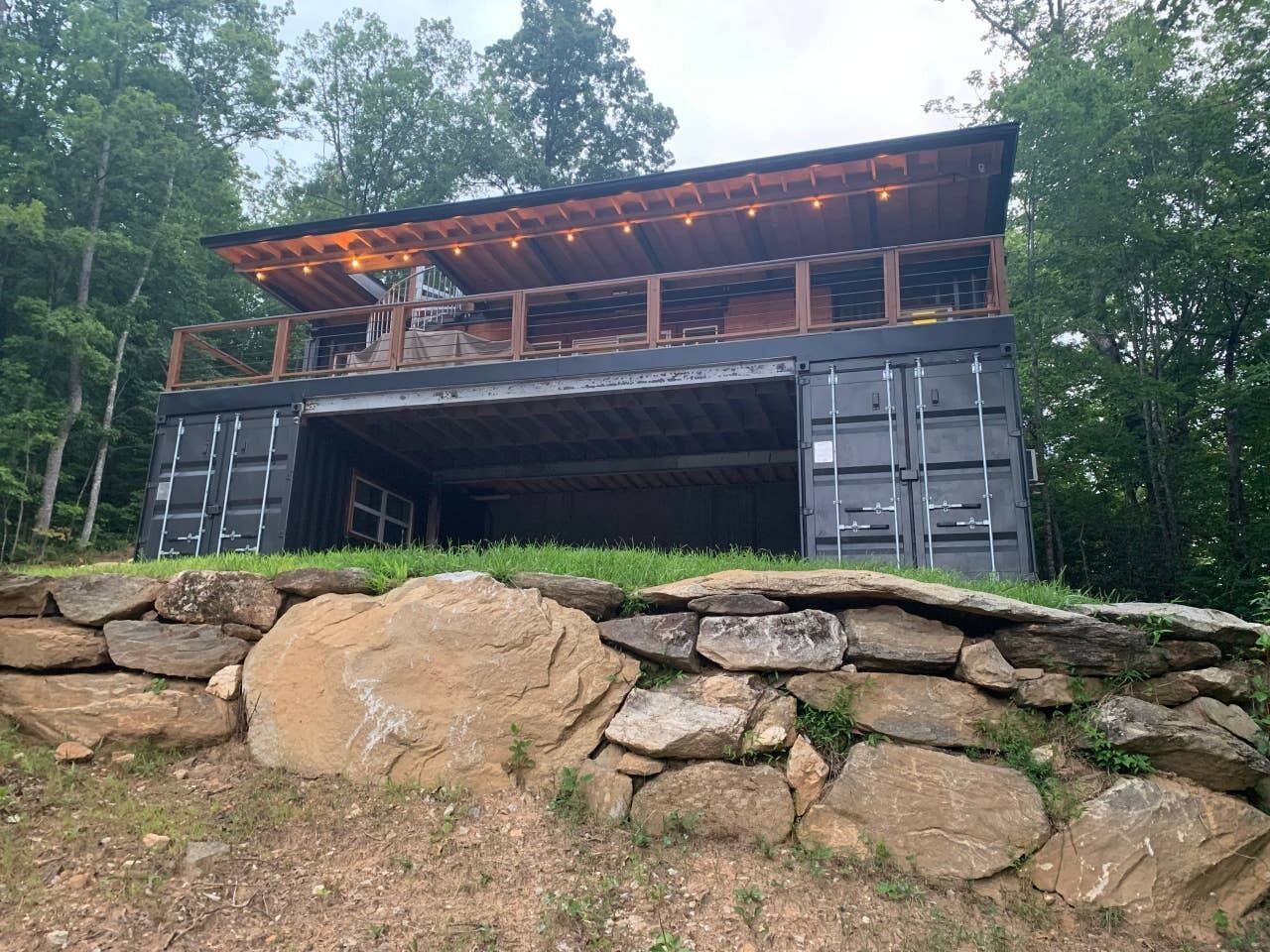 The 40' x 12' deck sits on top of two additional 20' containers and includes a l