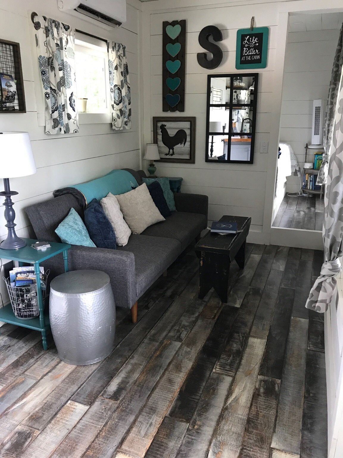 The living space has a full size couch, electric fire place and 55" TV (2018 Viz