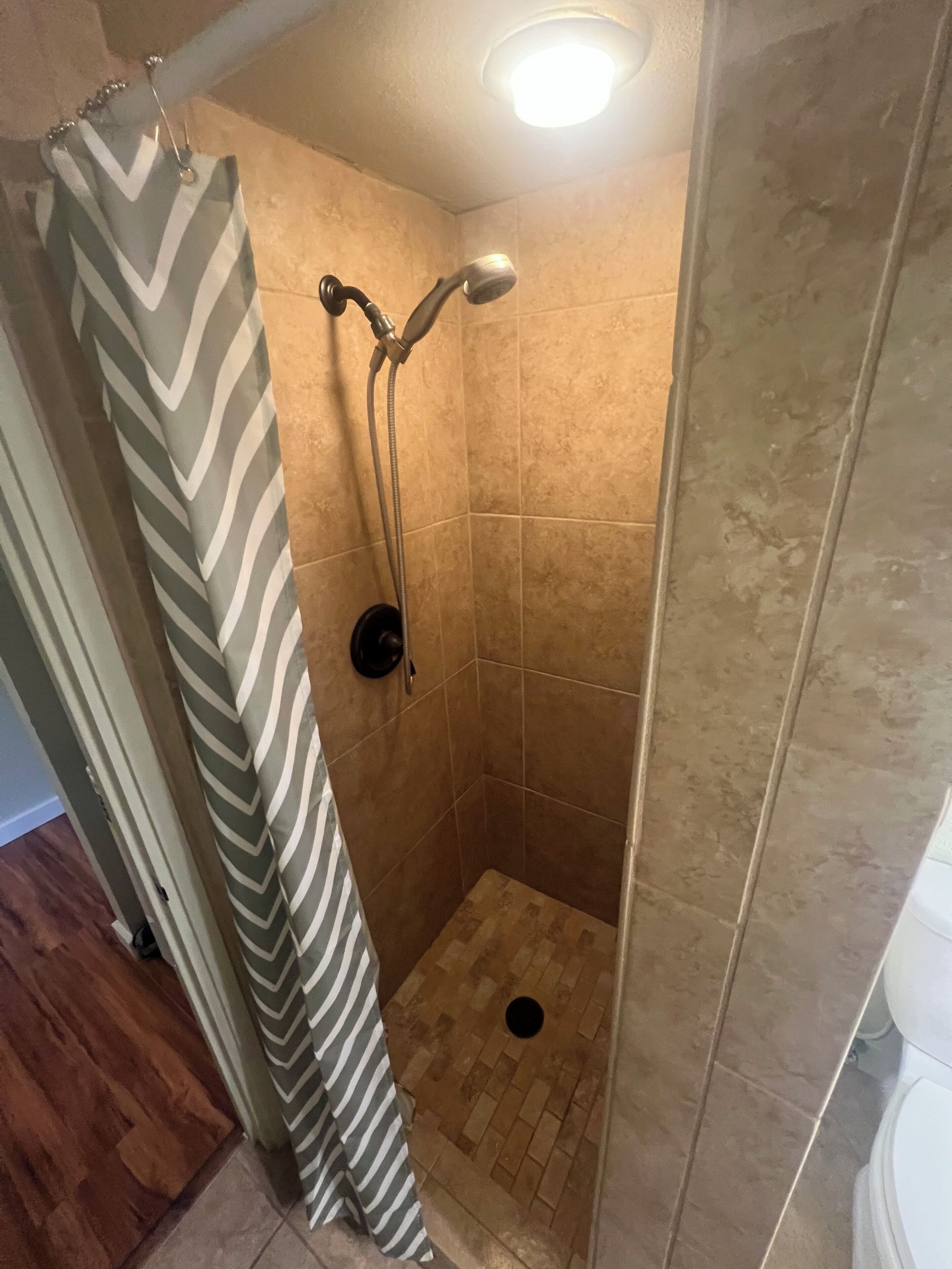 Shower, hair dryer, towels, toilet paper