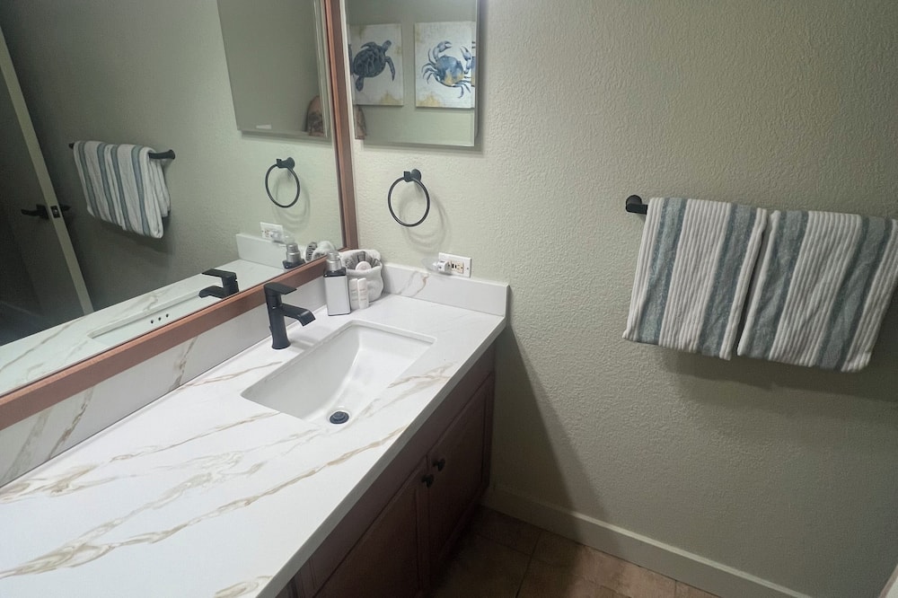 Shower, hair dryer, towels, toilet paper