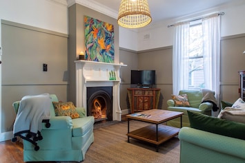 Sitting room with open fire for cosy winter nights. Reverse cycle air con also