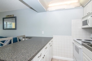 Fridge, microwave, oven, stovetop - Relaxing Treasure Island Condo Steps From Beach, Watch Sunset From Your Balcony! (Treasure Island)