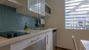 Fridge, microwave, stovetop, coffee/tea maker