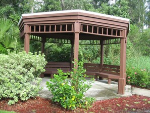 Situated in a beautifully landscaped garden, this gazebo offers a serene retreat.