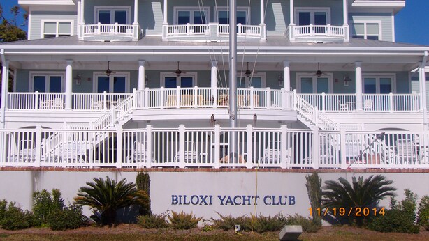 A large, multi-story building with balconies and a flagpole, labeled "BILOXI YACHT CLUB". - View the Beach from your porch.  
Best location, 5 blocks to downtown  (Biloxi)