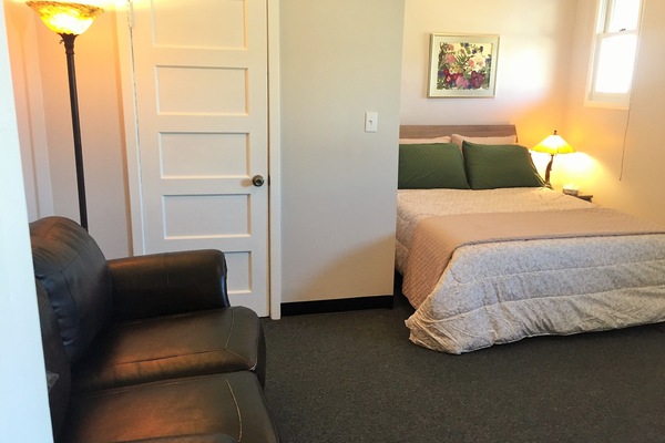 Comfortable bed, plush sofa and full walk-in closet.