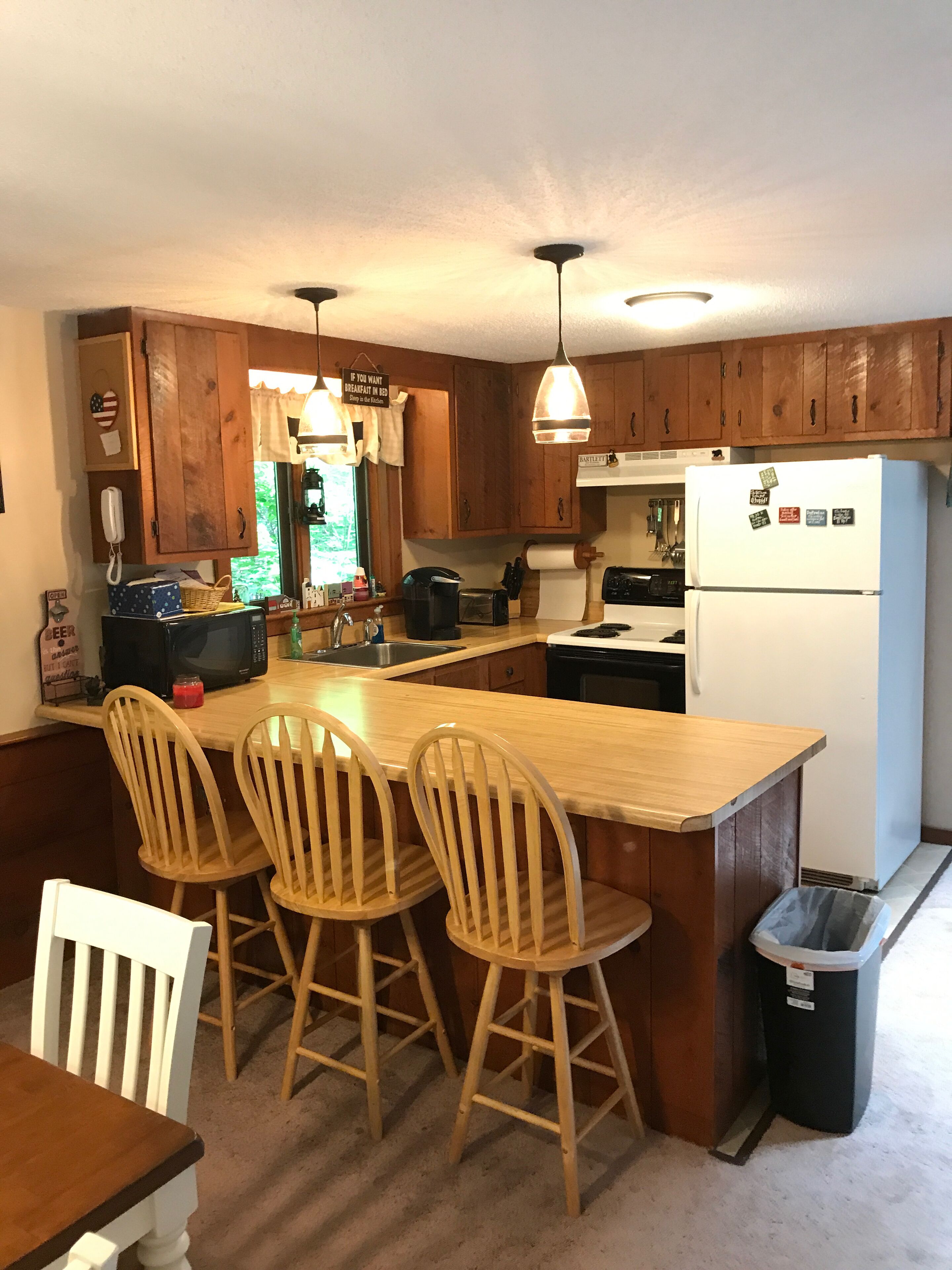 Fridge, microwave, oven, stovetop view of vacation home property