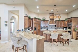 Coffee/tea maker, paper towels, dining tables