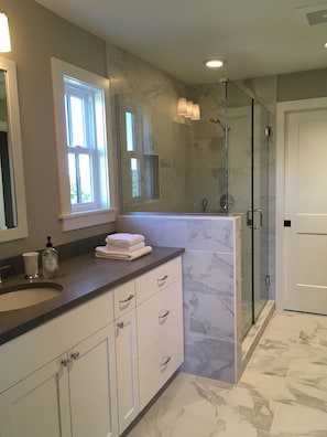Shower, hair dryer, towels, soap