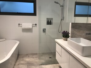 Bathtub, hair dryer, towels, soap