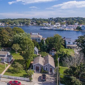 A residential area with houses, a dock, and a body of water.