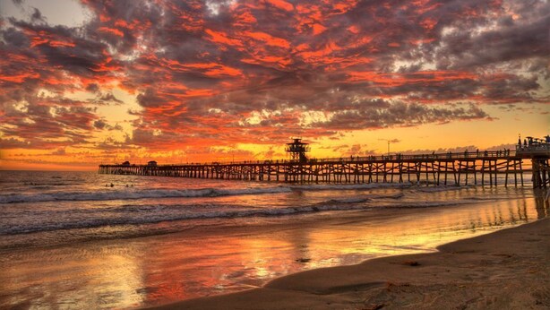 A pier extending into the ocean at sunset with a clear sky above. - Ocean View!  4 Minute Walk To Beach!  Walk to Everything! (San Clemente)