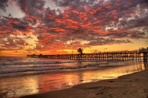 A pier extending into the ocean at sunset with a clear sky above. - Ocean View!  4 Minute Walk To Beach!  Walk to Everything! (San Clemente)
