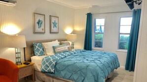 A bedroom with a bed, a nightstand, a chair, and a window with curtains. - Open Water views, 80' dock Private Pool Ice machine DIRECT ACCESS  open water (Marathon)
