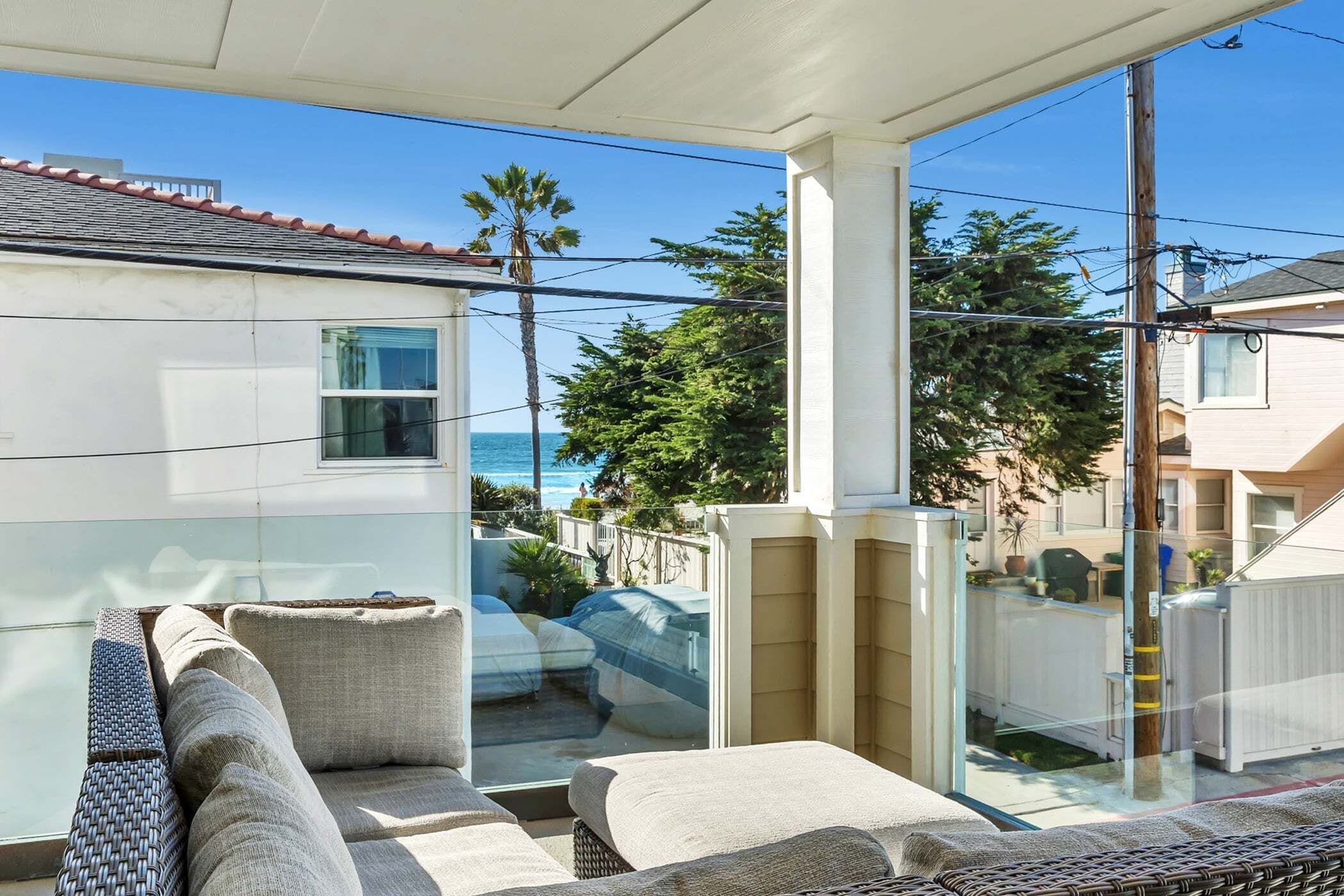 Balcony with seating and partial ocean views-perfect for morning coffee and enjoying the Mission Beach lifestyle