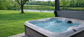 Relax at a cozy countryside retreat with a private hot tub, pond views & fire pit — pure bliss.