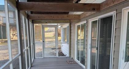 Relax at a cozy countryside retreat with a private hot tub, pond views & fire pit — pure bliss.