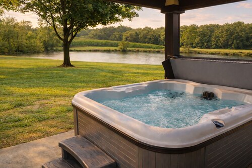 Relax at a cozy countryside retreat with a private hot tub, pond views & fire pit — pure bliss.