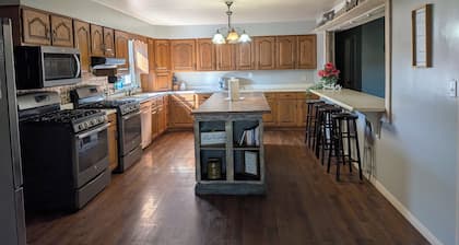 Relax at a cozy countryside retreat with a private hot tub, pond views & fire pit — pure bliss.