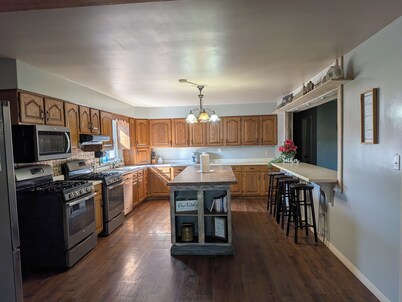 Relax at a cozy countryside retreat with a private hot tub, pond views & fire pit — pure bliss.