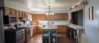 Relax at a cozy countryside retreat with a private hot tub, pond views & fire pit — pure bliss.