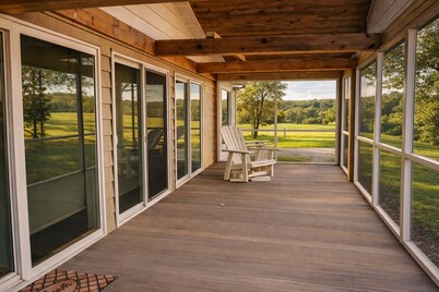 Relax at a cozy countryside retreat with a private hot tub, pond views & fire pit — pure bliss.