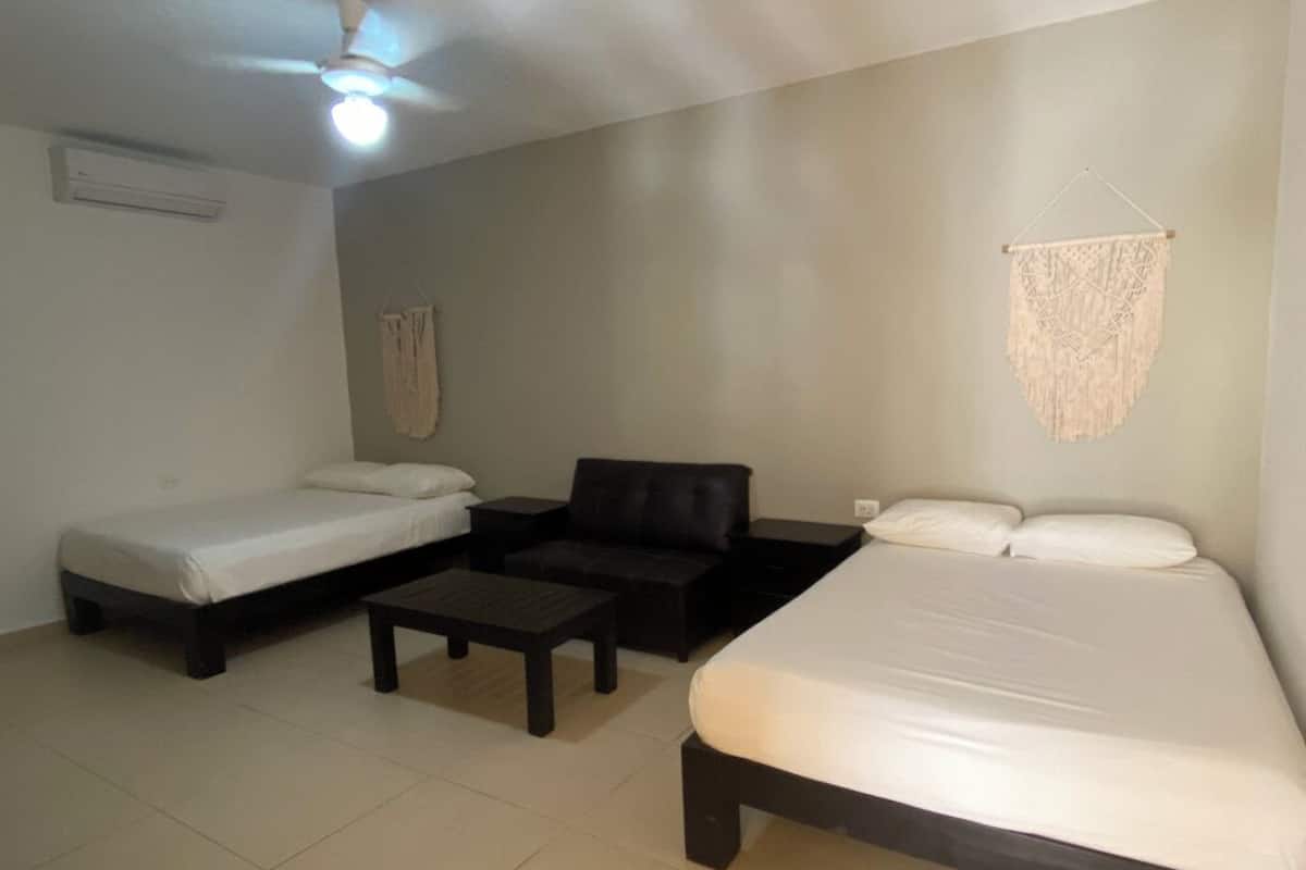 Suite exclusiva, 2 camas Queen size | 1 habitación, cortinas blackout, insonorización y wifi gratis