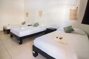 Suite exclusiva, varias camas | Cortinas blackout, insonorización, wifi gratis y ropa de cama