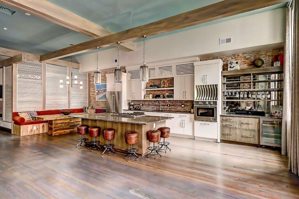 Large kitchen with bar, dining table and tons of seating