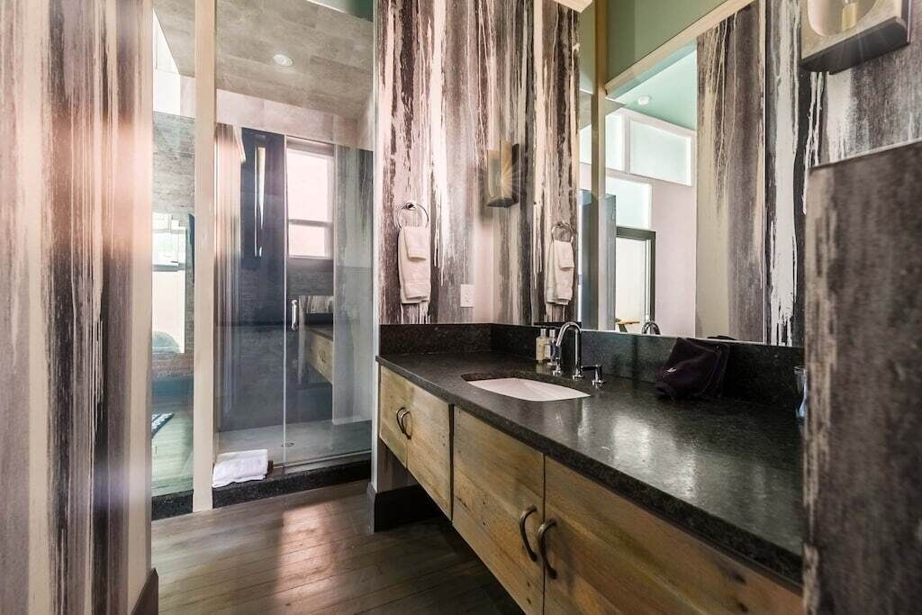 Full bathroom with large shower off of bedroom 