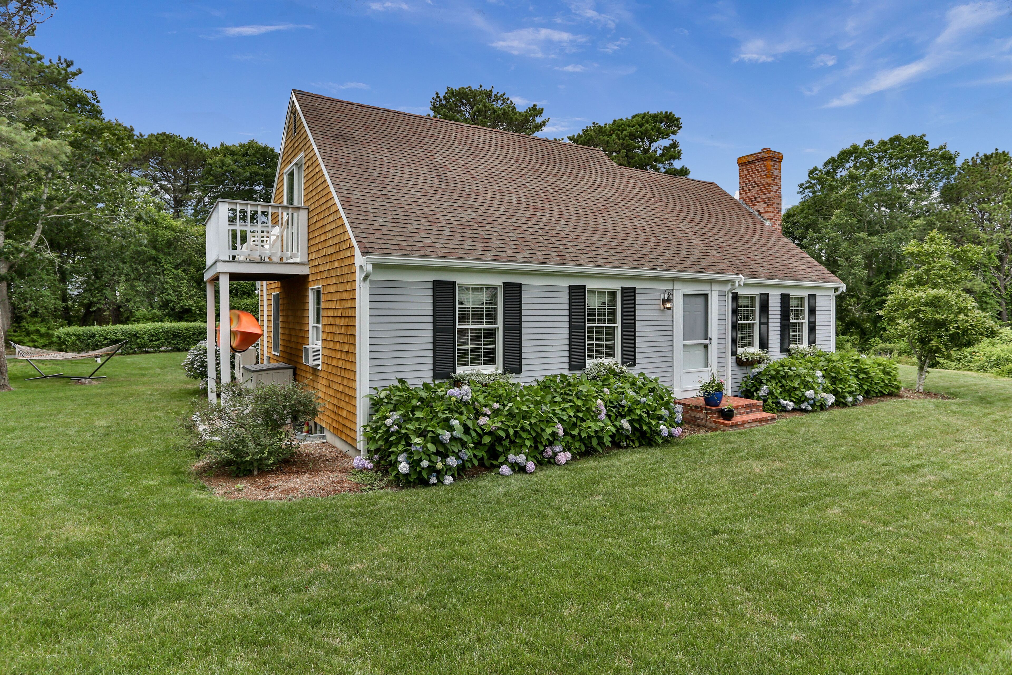 Private setting with large grass yard abutting conservation land