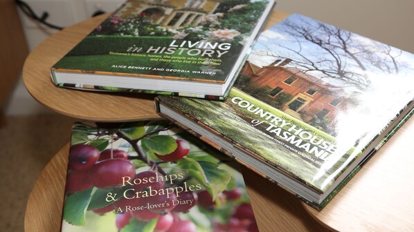 Three books titled 'Living in History', 'Country House of Tasmania', and 'Rosehips & Crabapples'.