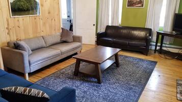 Flat-screen TV, DVD player, table football, books