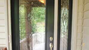 A black front door with a glass panel and a brass doorknob. - Wonderful home with dock on Tellico Lake (Loudon)