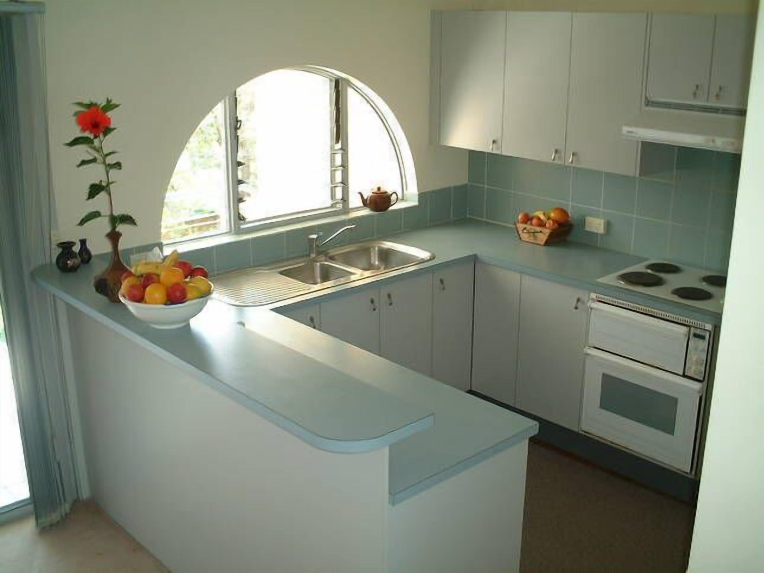 Kitchen, with balcony looking over courtyard.