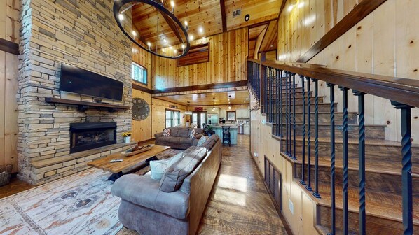 Televisión, chimenea, reproductor de DVD y futbolito 