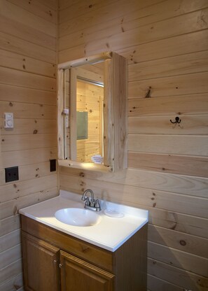 Combined shower/bathtub, towels, soap, toilet paper