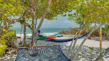 On the beach, sun loungers, beach towels
